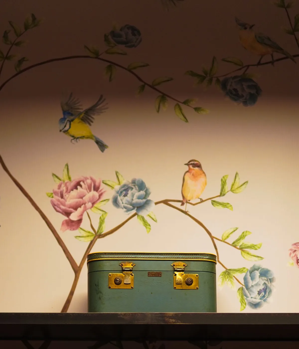 Hand-painted chinoiserie mural wallpaper with songbirds, peonies, and trailing branches